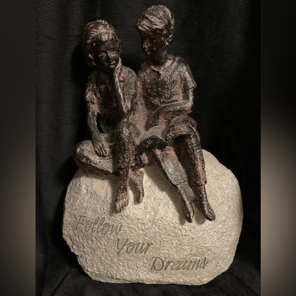 Follow Your Dreams ornament of boy and girl sitting on a rock